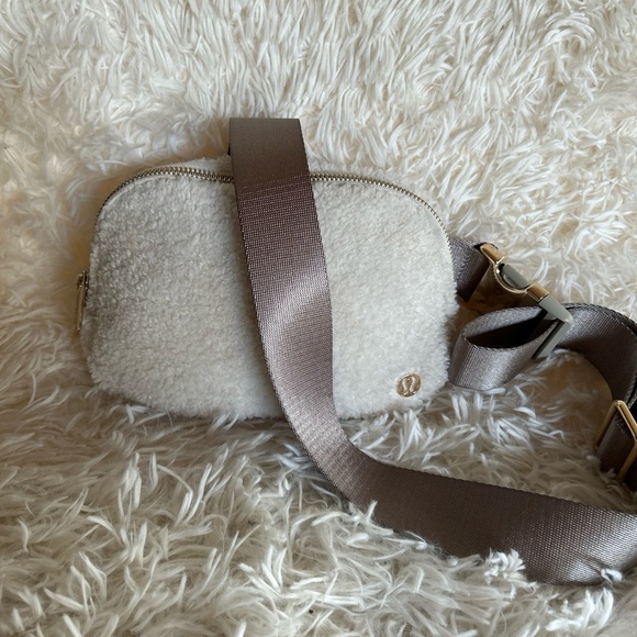 Lululemon Handbags - Lululemon Everywhere fleece Bag Belt Golden Ivory 8.5”x6” 2” Inches